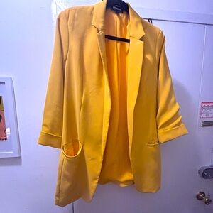 Women’s Yellow Blazer. Express. Two pockets. 3/4 length sleeve. Size large.